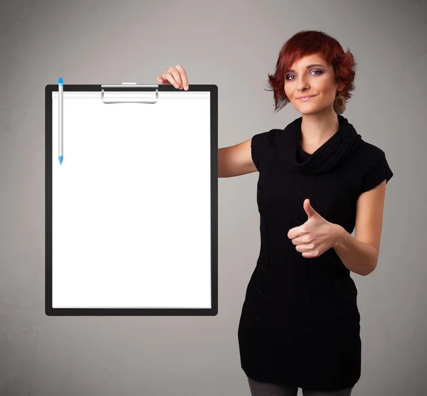 Young girl holding black folder with white sheet copy space — Stock Photo, Image