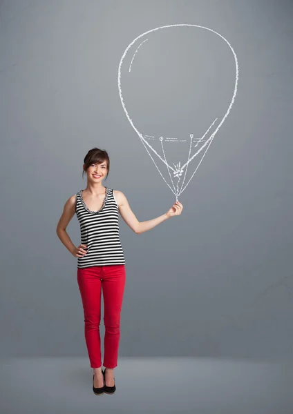Mulher bonita segurando desenho de balão — Fotografia de Stock