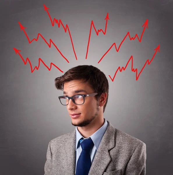 Handsome man thinking with arrows overhea — Stock Photo, Image