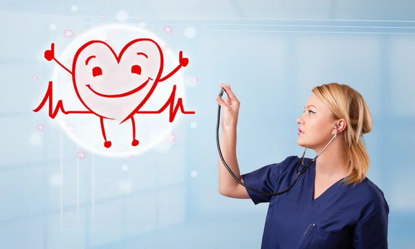 Attractive doctor with happy red smiling heart — Stock Photo, Image