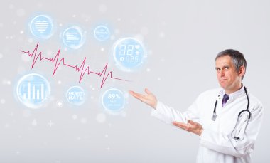 Doktor modern kalp atışları grafiklerini inceliyor.