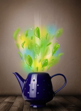 Yapraklı çay demliği ve renkli soyut ışıklar