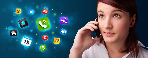 Young woman calling by phone with various icons — Stock Photo, Image