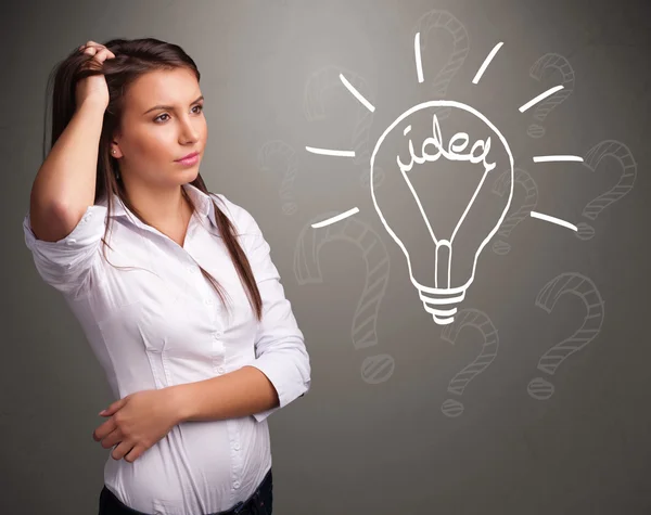 Young girl comming up with a light bubl idea sign — Stock Photo, Image