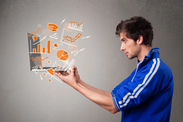 Handsome man holding laptop with graphs and statistics — Stock Photo, Image