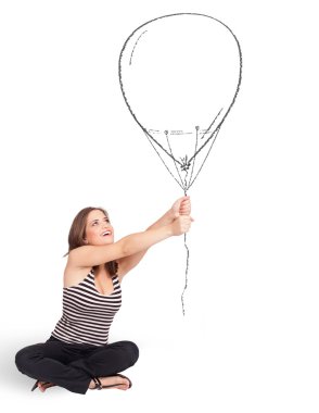 Güzel bir kadın balon çiziyor.