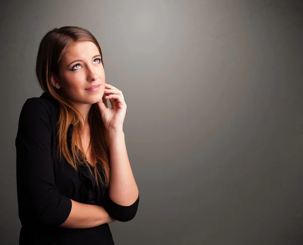 Beautiful woman thinking with empty copy space — Stock Photo, Image