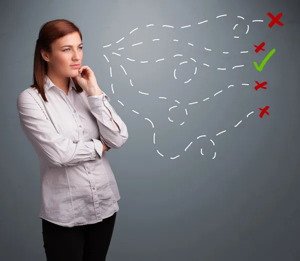 Young woman choosing between right and wrong signs — Stock Photo, Image