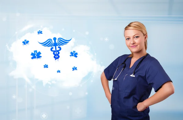 Young doctor with abstract cloud and medical icons — Stock Photo, Image
