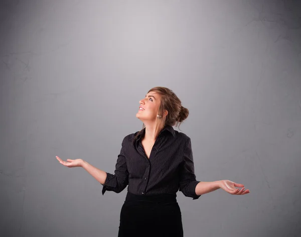 Beautiful young lady juggling with copy space — Stock Photo, Image