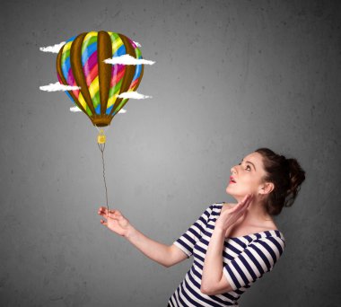 bir balon çizim tutan kadın