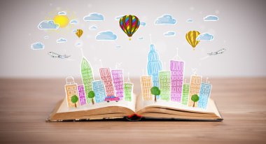 Açık kitap üzerine şehir manzarası çizimi