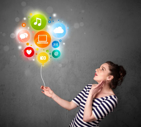 Woman holding social media balloon — Stock Photo, Image