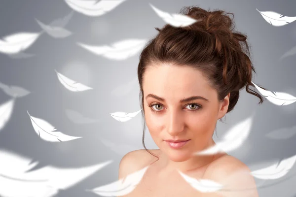 Beautifull young girl with light feather skin concept — Stock Photo, Image