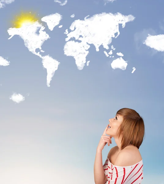 Young girl looking at world clouds and sun on blue sky — Stock Photo, Image