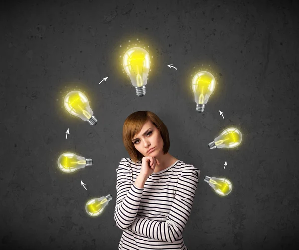 Young woman thinking with lightbulb circulation around her head — Stock Photo, Image