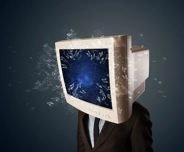 Computer monitor screen exploding on a young persons head — Stock Photo, Image