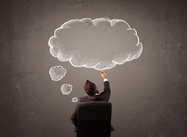Businessman sitting with cloud thought above his head — Stock Photo, Image