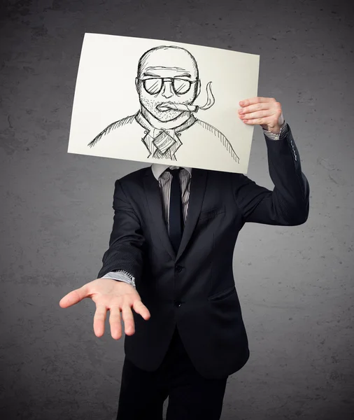 Businessman holding a cardboard with a smoking man on it in fron — Stock Photo, Image