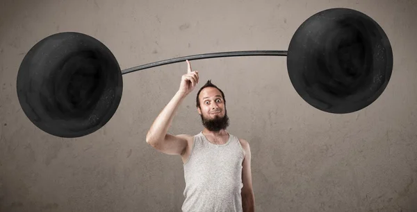 Funny skinny guy lifting weights — Stock Photo, Image