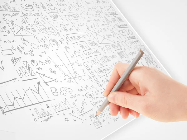 Human hand sketching ideas on a white paper — Stock Photo, Image