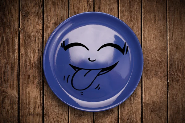 Happy smiley cartoon face on colorful dish plate — Stock Photo, Image