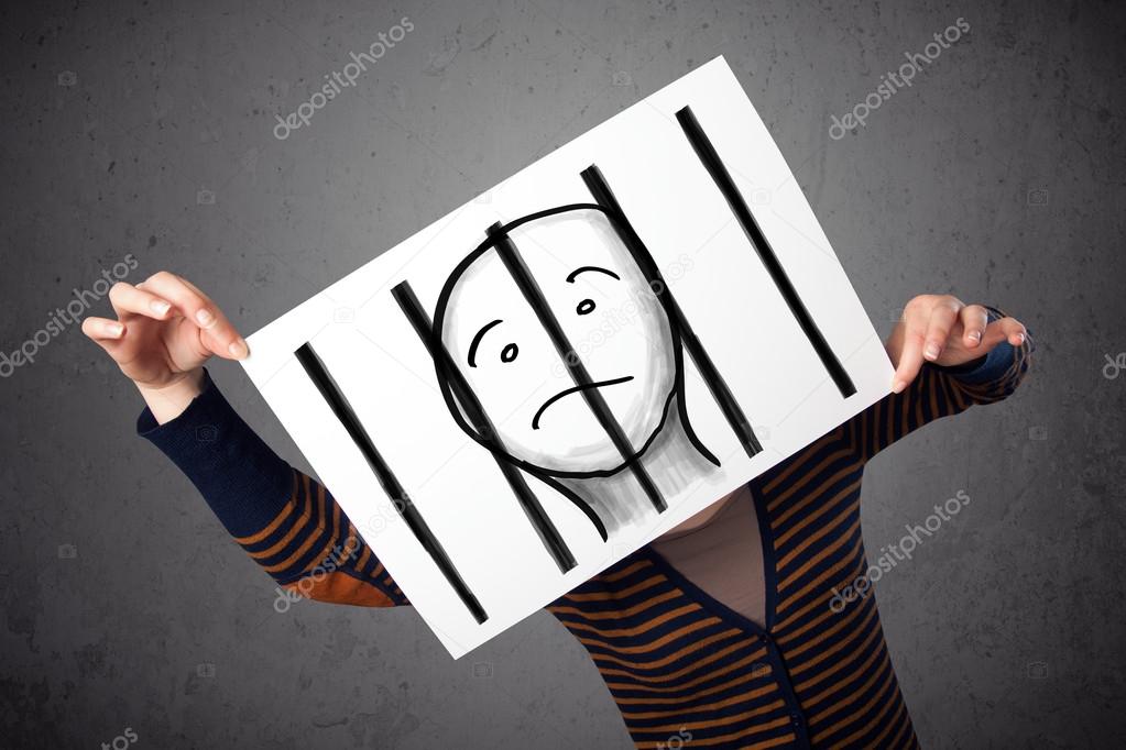 Woman holding a paper with a prisoner behind the bars on it in f