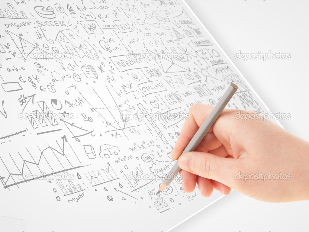 Human hand sketching ideas on a white paper