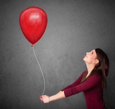 Kırmızı balon tutan kadın