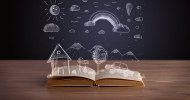Elle çizilmiş peyzaj ile açık kitap
