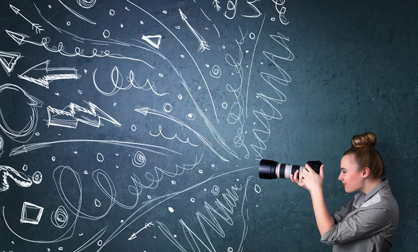 Photographer shooting images while energetic hand drawn lines an — Stock Photo, Image
