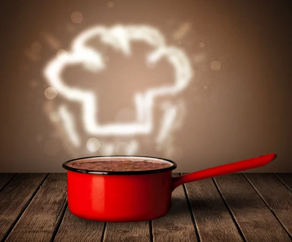 Chef hat above cooking pot — Stock Photo, Image