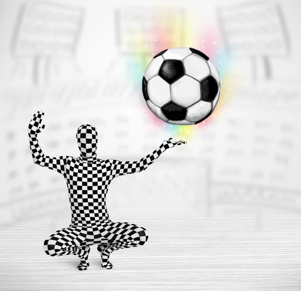 Man in full body suit holdig soccer ball — Stock Photo, Image