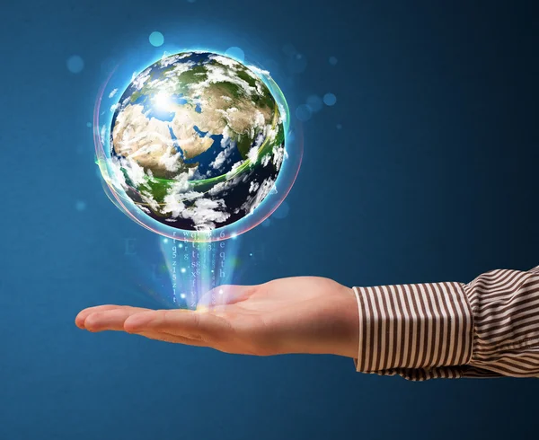 Businessman holding a glowing earth globe — Stock Photo, Image