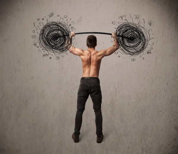 Muscular man lifting chaos concept — Stock Photo, Image
