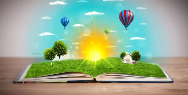 Open book with green nature world coming out of its pages — Stock Photo, Image