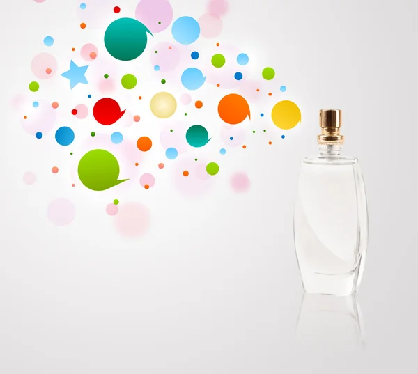 Perfume bottle spraying colored bubbles — Stock Photo, Image