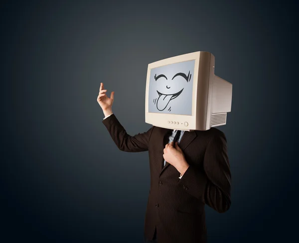 Hombre de negocios feliz con un monitor de computadora y una cara sonriente —  Fotos de Stock