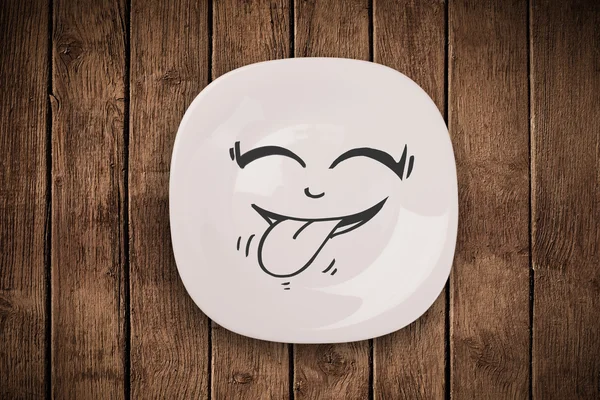 Happy smiley visage de dessin animé sur plaque de plat coloré — Photo