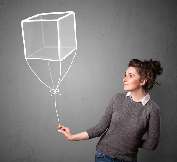 女人拿着多维数据集气球 — 图库照片