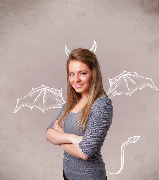 Young girl with devil horns and wings drawing — Stock Photo, Image