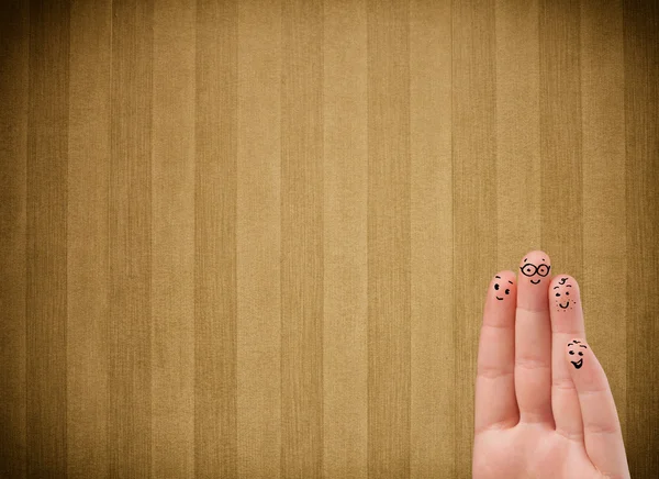 Sorrisos dedo feliz com fundo de papel de parede tarja vintage — Fotografia de Stock