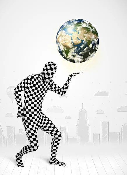 Man in full body suit holding planet earth — Stock Photo, Image