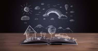 Elle çizilmiş peyzaj ile açık kitap