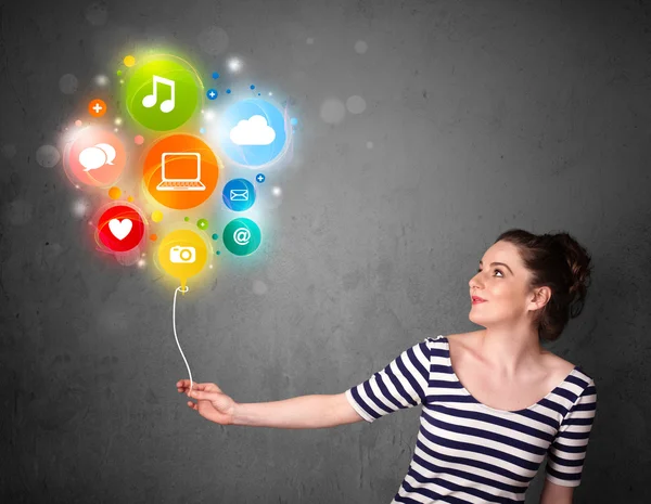 Woman holding social media balloon — Stock Photo, Image