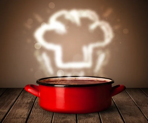 Chef sombrero por encima de olla de cocina — Foto de Stock