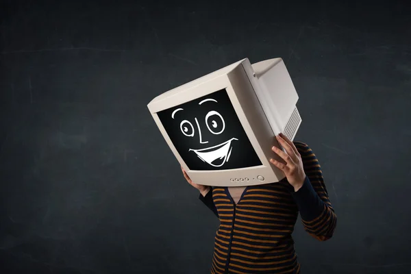 Girl with a monitor head and a cheerful cartoon face — Stock Photo, Image