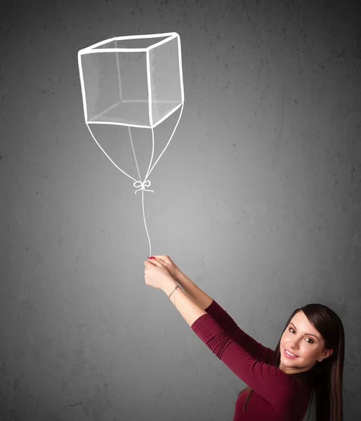 Donna in possesso di un palloncino cubo — Foto Stock