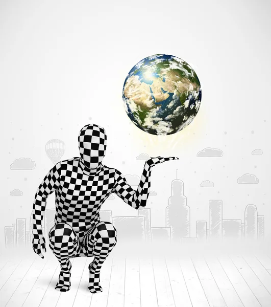 Man in full body suit holding planet earth — Stock Photo, Image