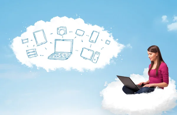 Young woman sitting in cloud with laptop — Stock Photo, Image